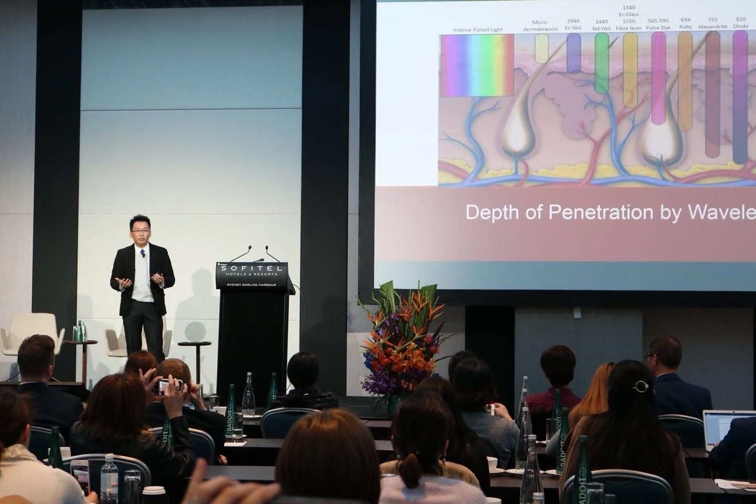 Dr Chun-Yen Huang explaining PicoSure laser wavelength and penetration principles to a professional audience