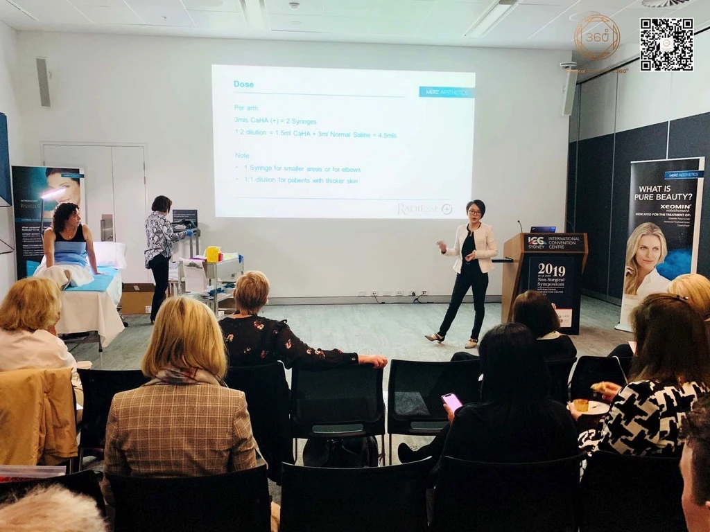 Dr Luo speaking to clinical professionals at a professional education event
