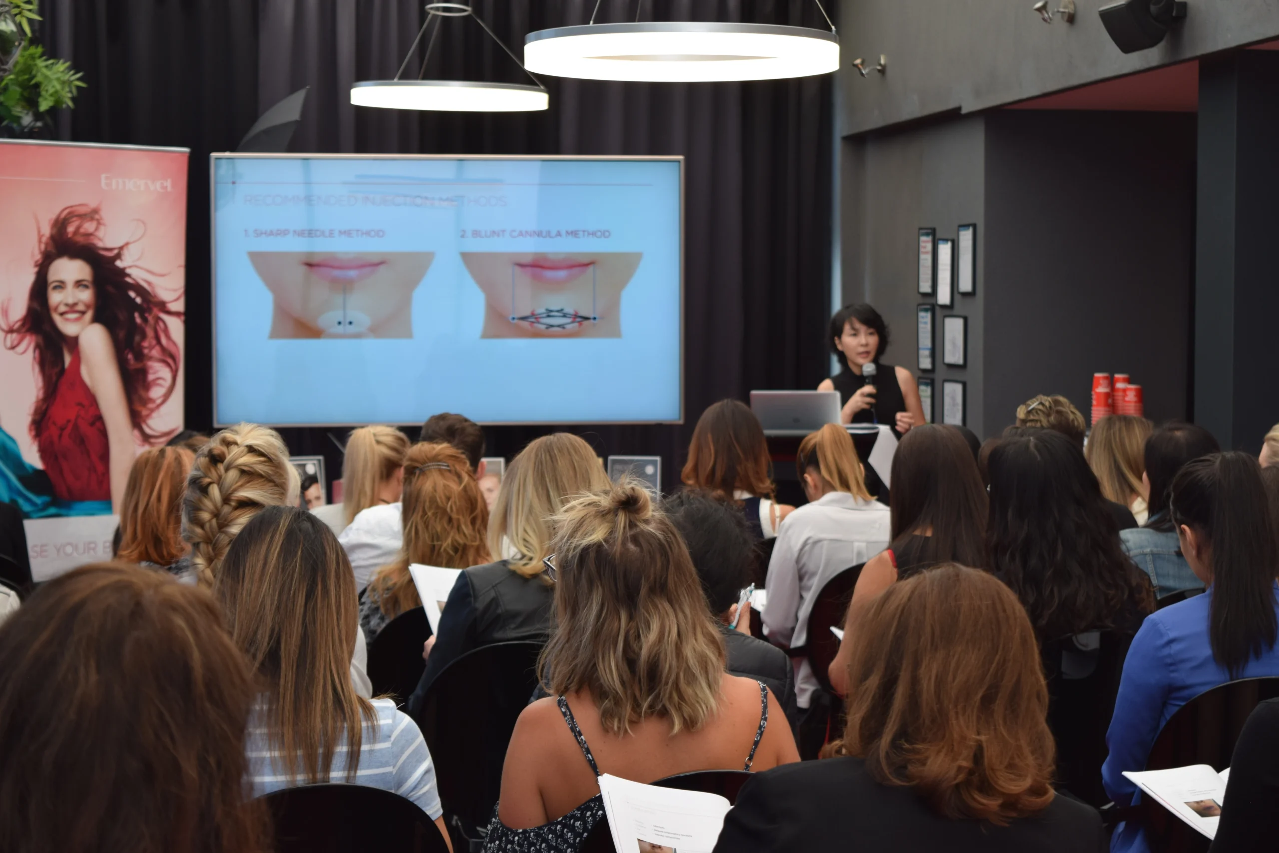 Dr Luo explaining assessment points during a workshop for clinical professionals