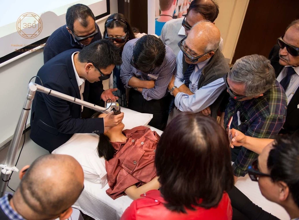 Dr Chun-Yen Huang speaking about the RevLite SI laser and conducting a live workshop demonstration