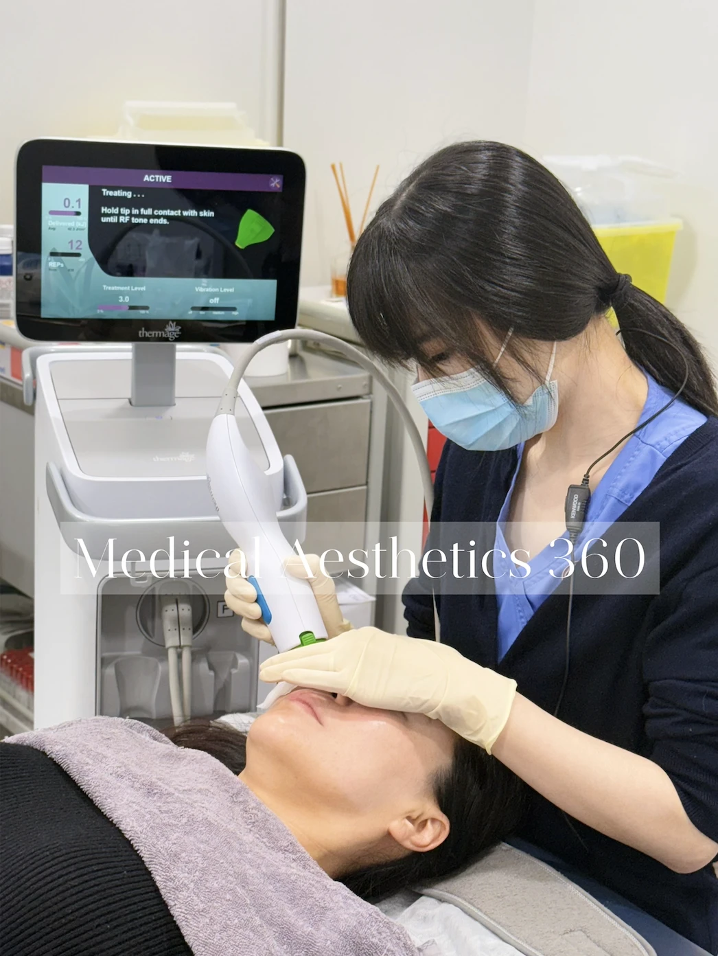 A clinician using a Thermage handpiece during a treatment at Medical Aesthetics 360